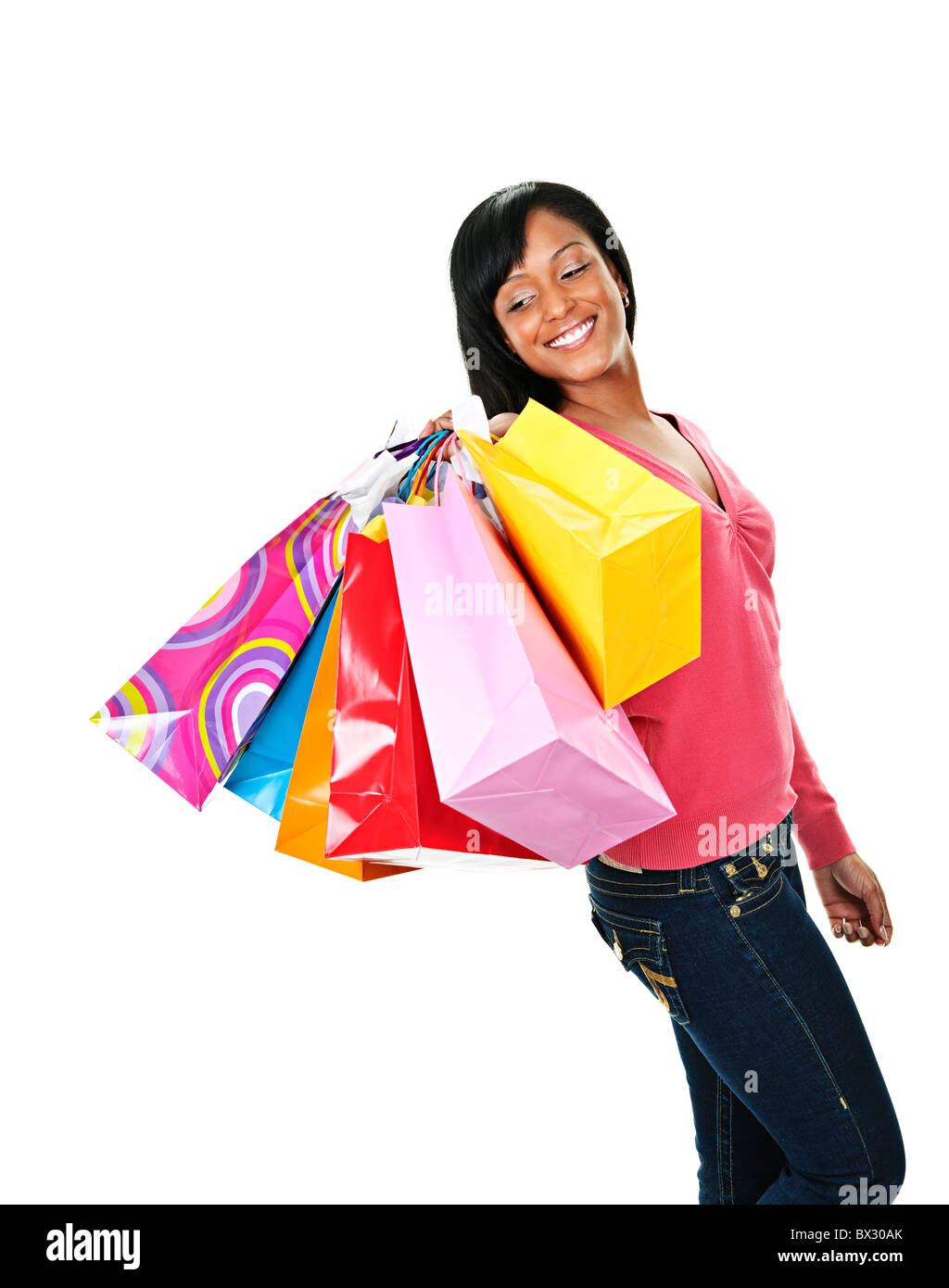 Young joyful black woman holding shopping bags Stock Photo - Alamy