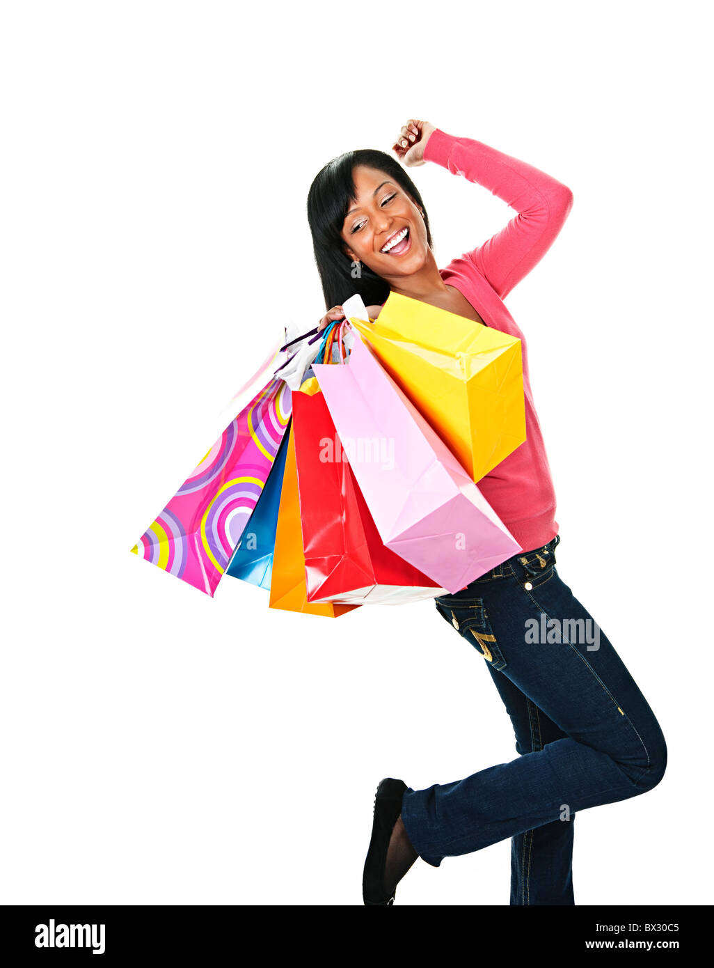 Young excited smiling black woman holding shopping bags Stock Photo - Alamy