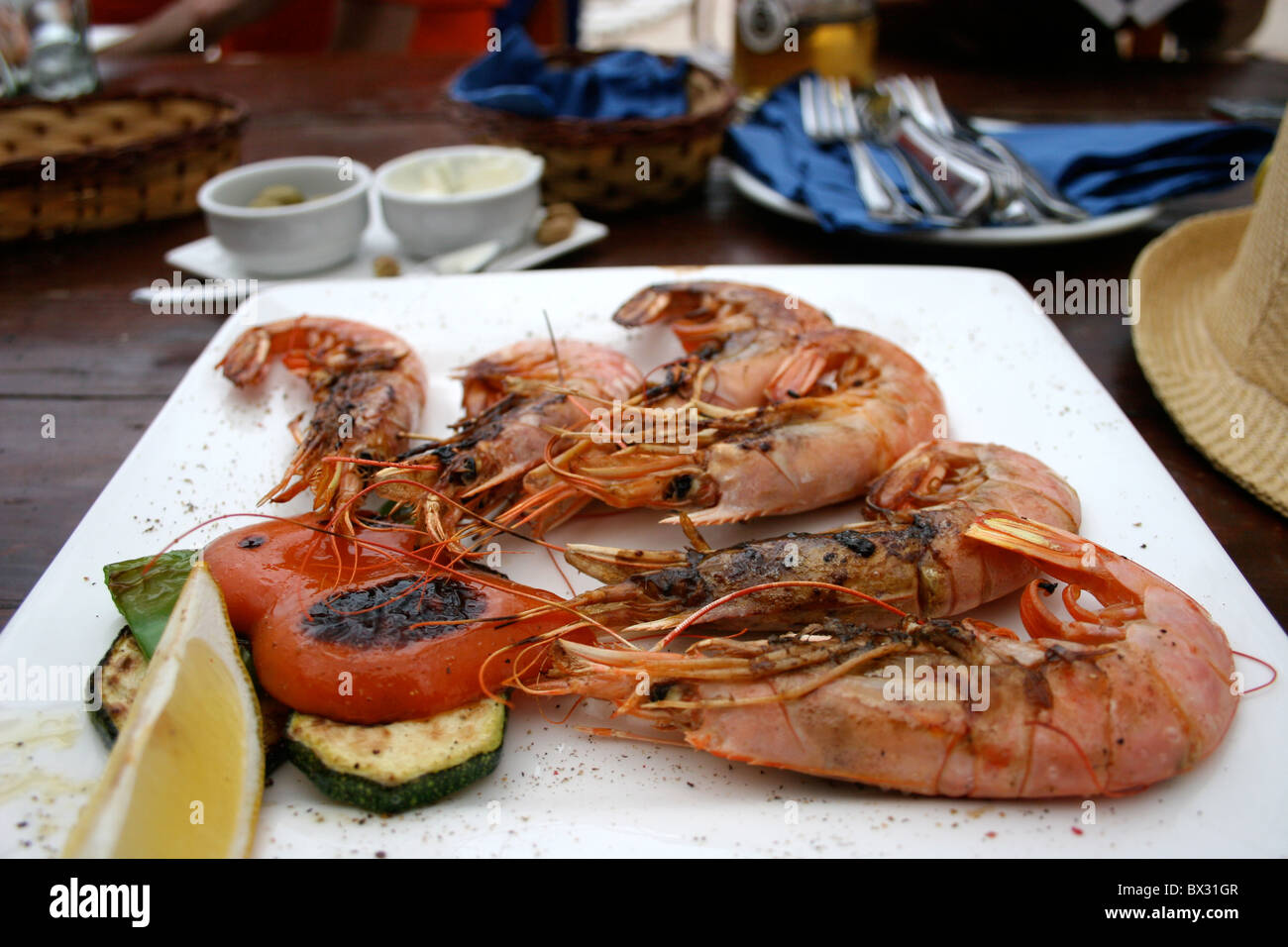 Plate of  unpeeled Prawns Stock Photo