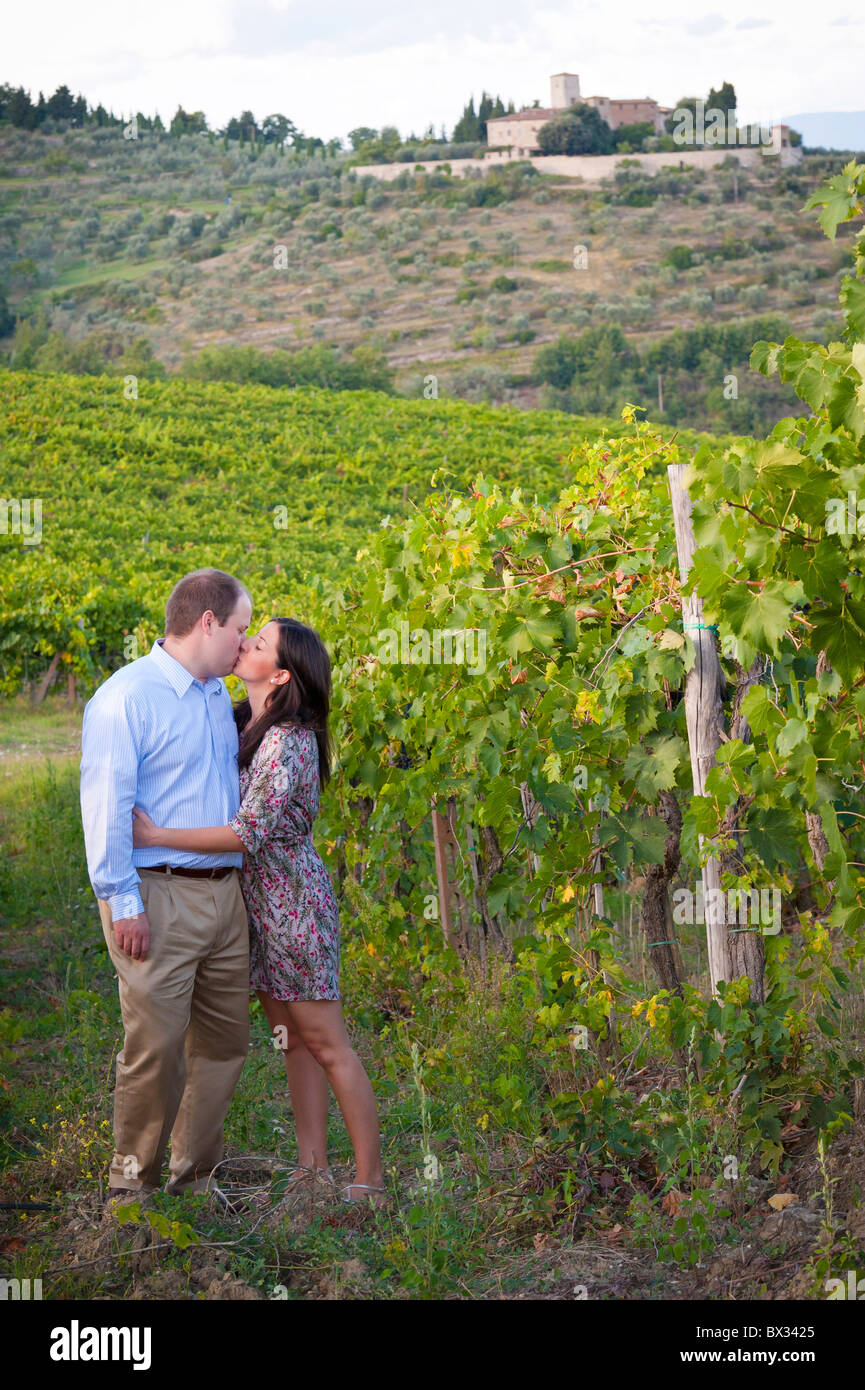 Couple kissing in a vineyard underneath Greve in Chianti Italy Stock Photo
