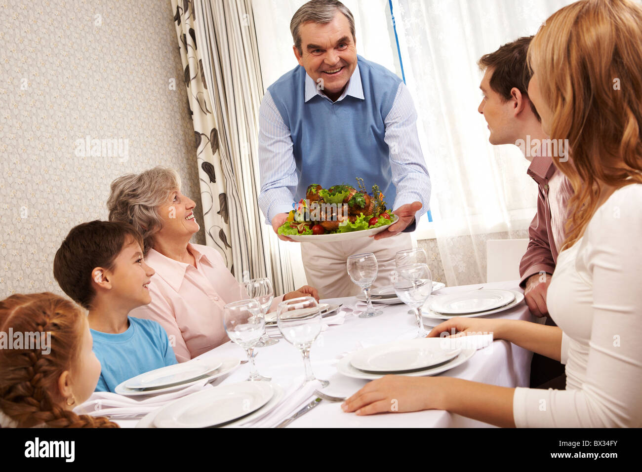 Portrait of big family at festive table at home Stock Photo - Alamy