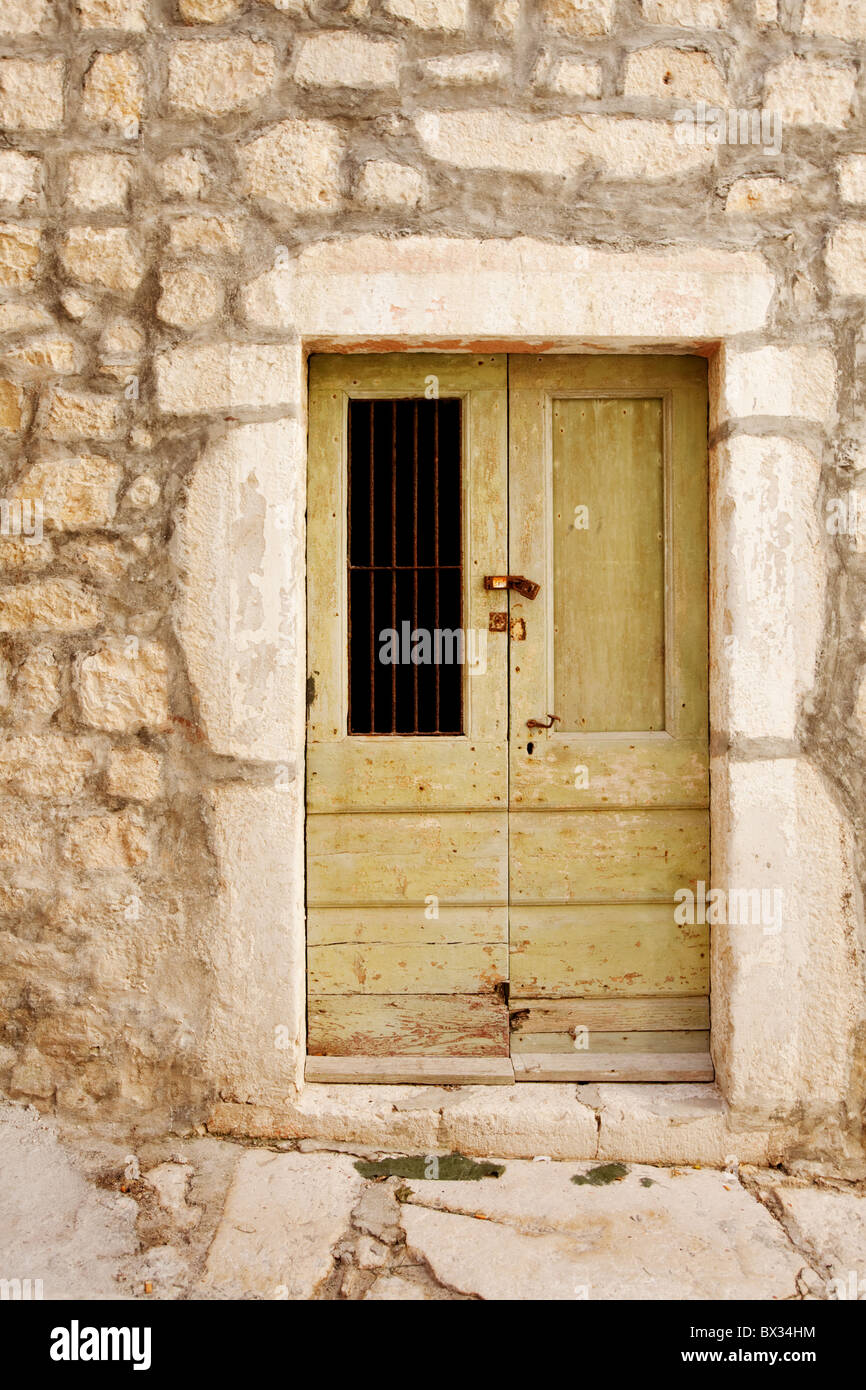 An old wooden door in a stone building Stock Photo - Alamy