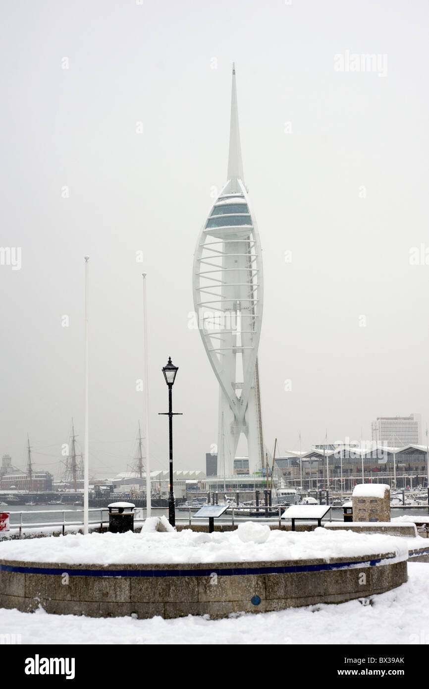 spinnaker tower in portsmouth against a steely gray sky during snow