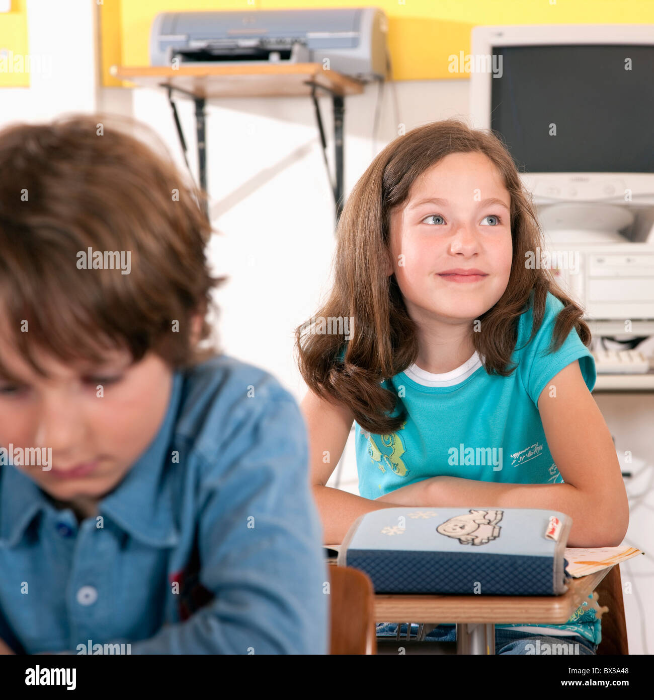 portrait of young girl sitting in classroom Stock Photo