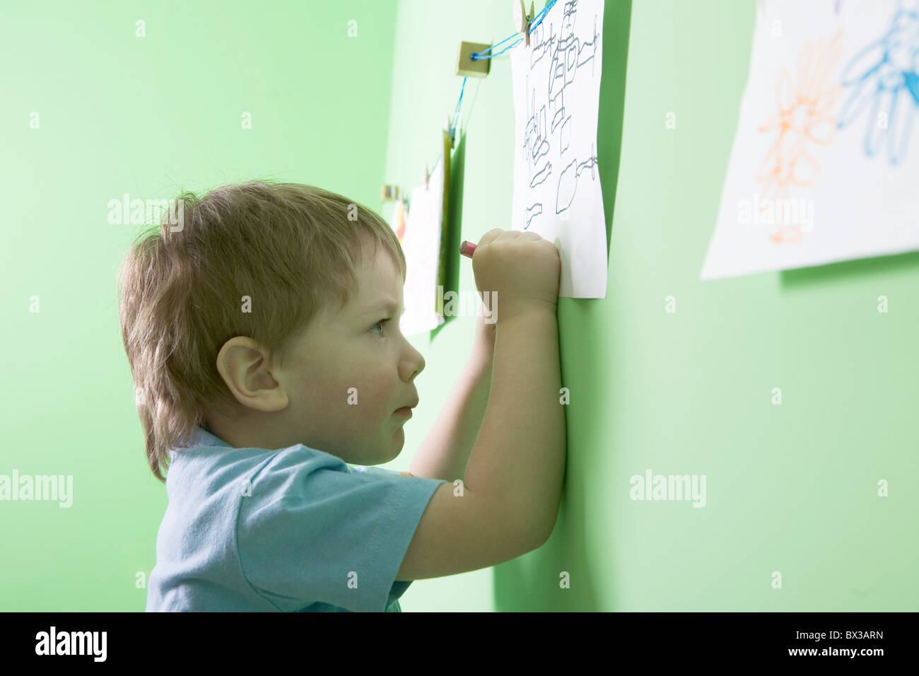 young boy making drawing Stock Photo - Alamy