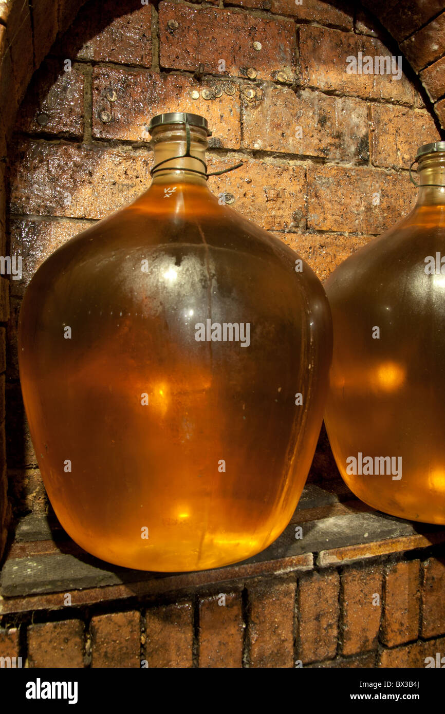 wine demijohn in the wine cave Stock Photo Alamy
