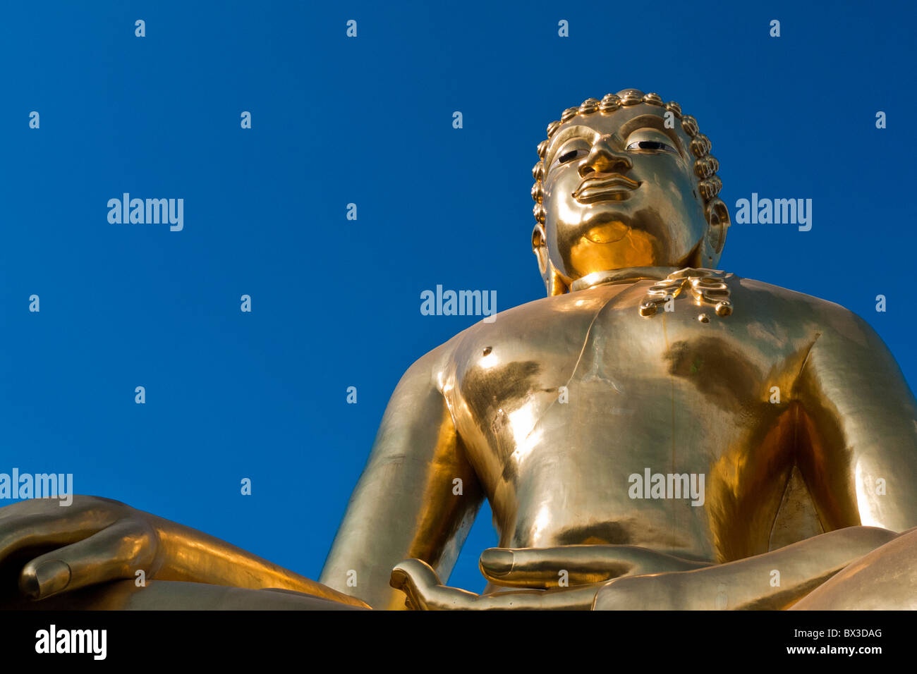 Gold Buddha Image with deep blue sky Stock Photo - Alamy