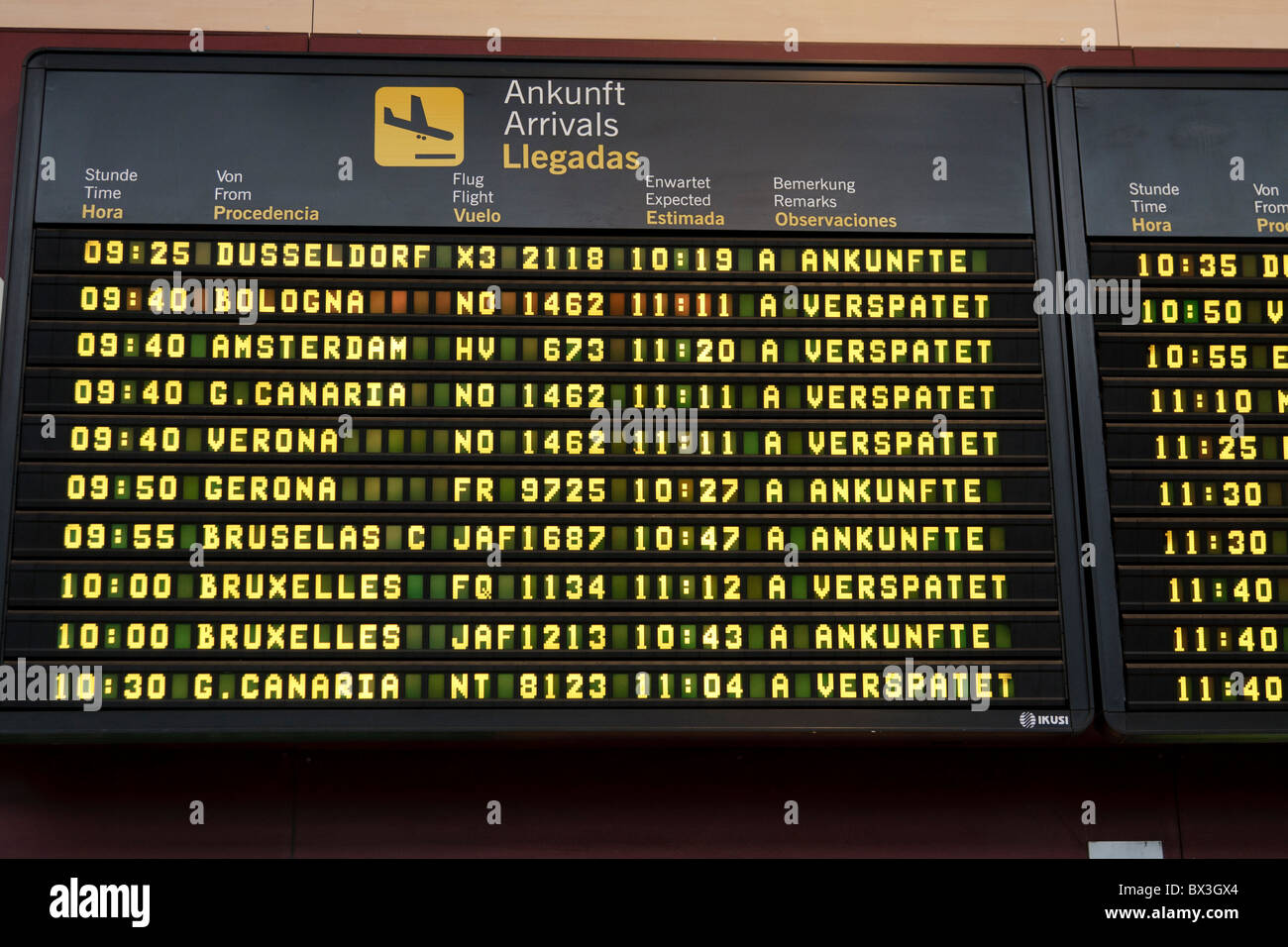 Arrivals board at Tenerife airport showing delays for flights Stock Photo