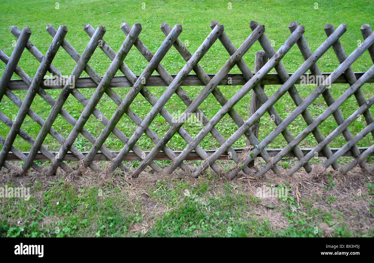 wooden fence with green grass Stock Photo