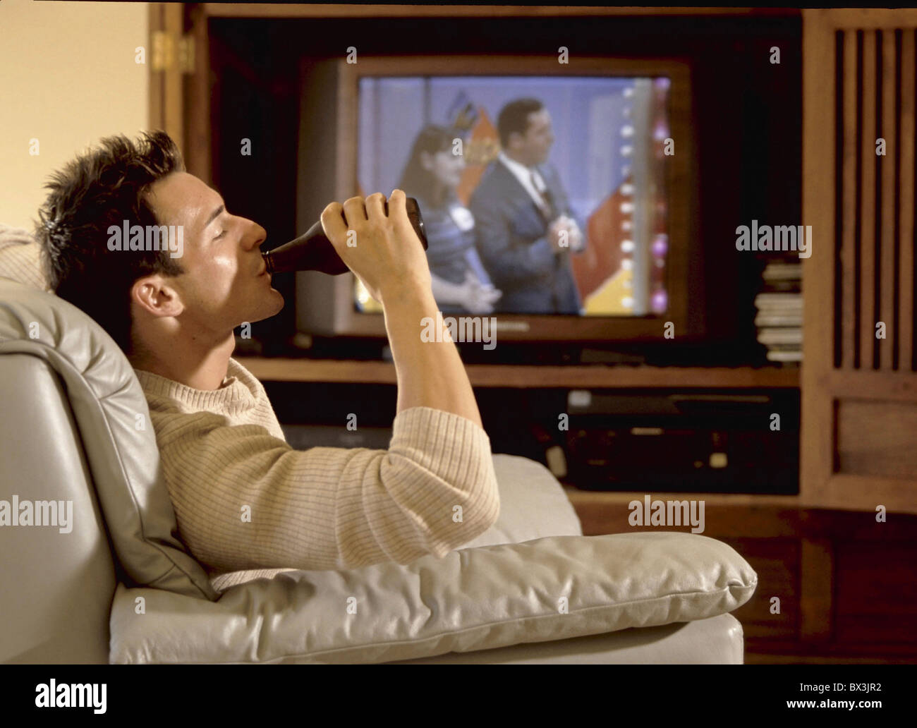 man drinking getting drunk drinking TV television alcohol beer problem