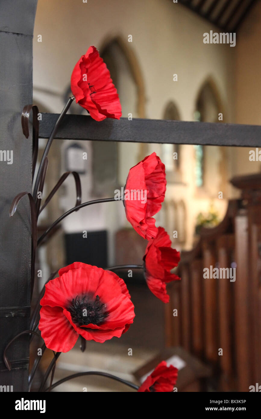 Close-up of an artificial poppy display for Remembrance day in November - UK. Focus on foreground Stock Photo