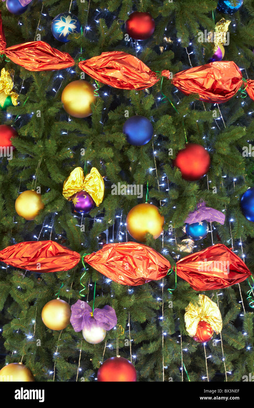 Part of Christmas fir tree decorated with colorful toy balls and ...
