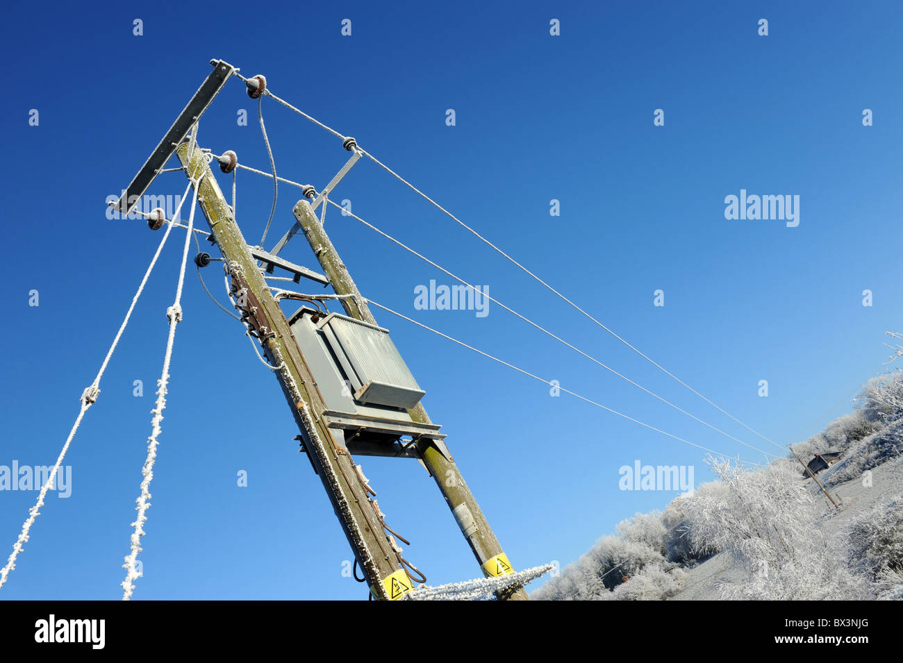 Winter frost on electric power lines uk Stock Photo