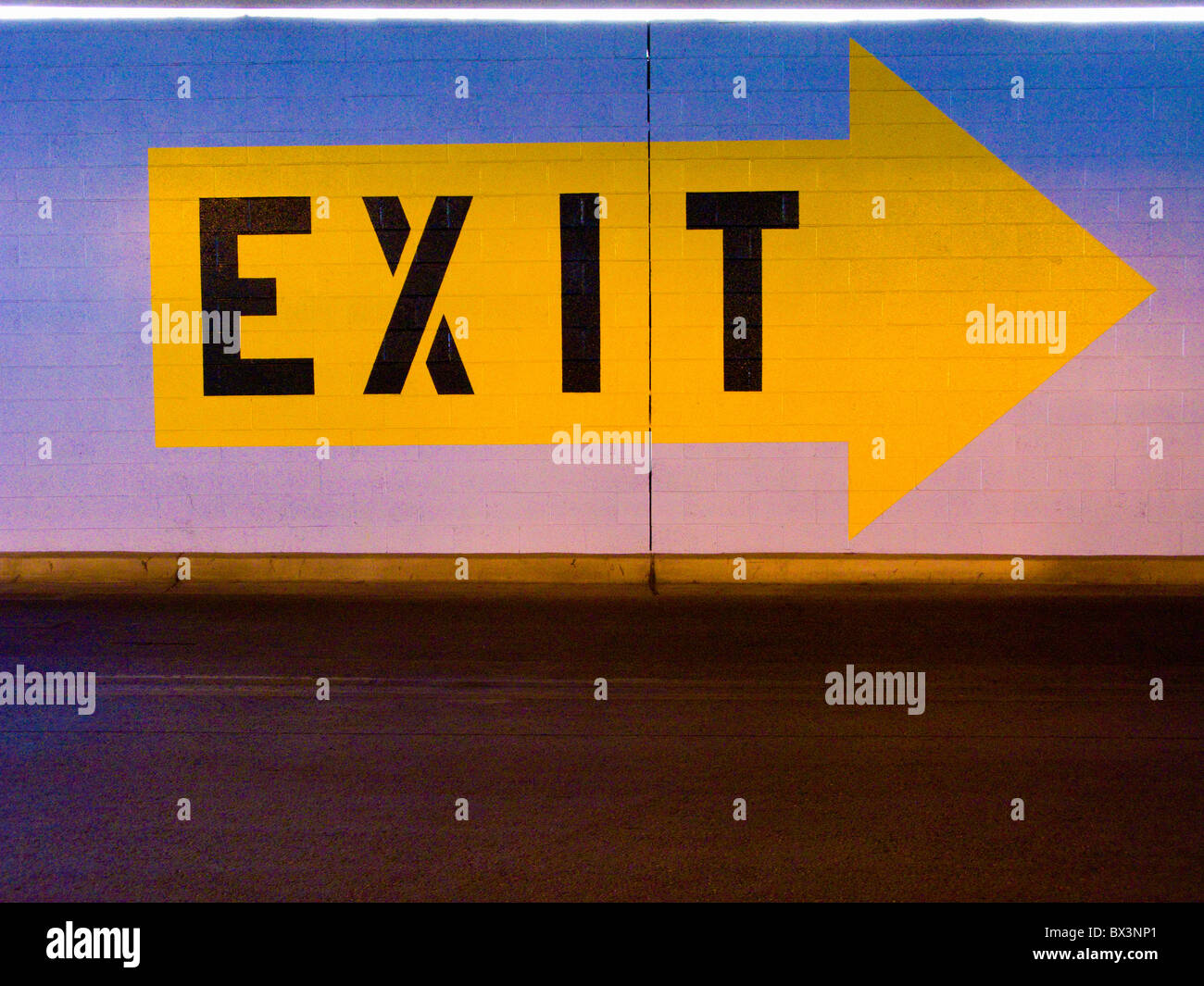 Exit sign in parking garage Stock Photo Alamy