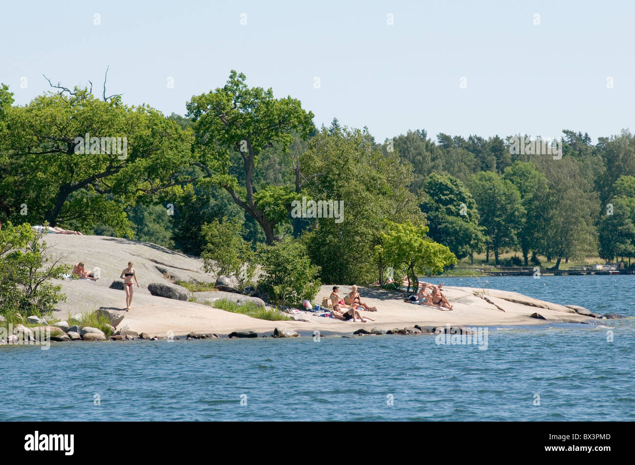 swedish people enjoying the warm summer sunshine on an island in the Stockholm  archipelago archipelagos sweden swedish blue sky Stock Photo