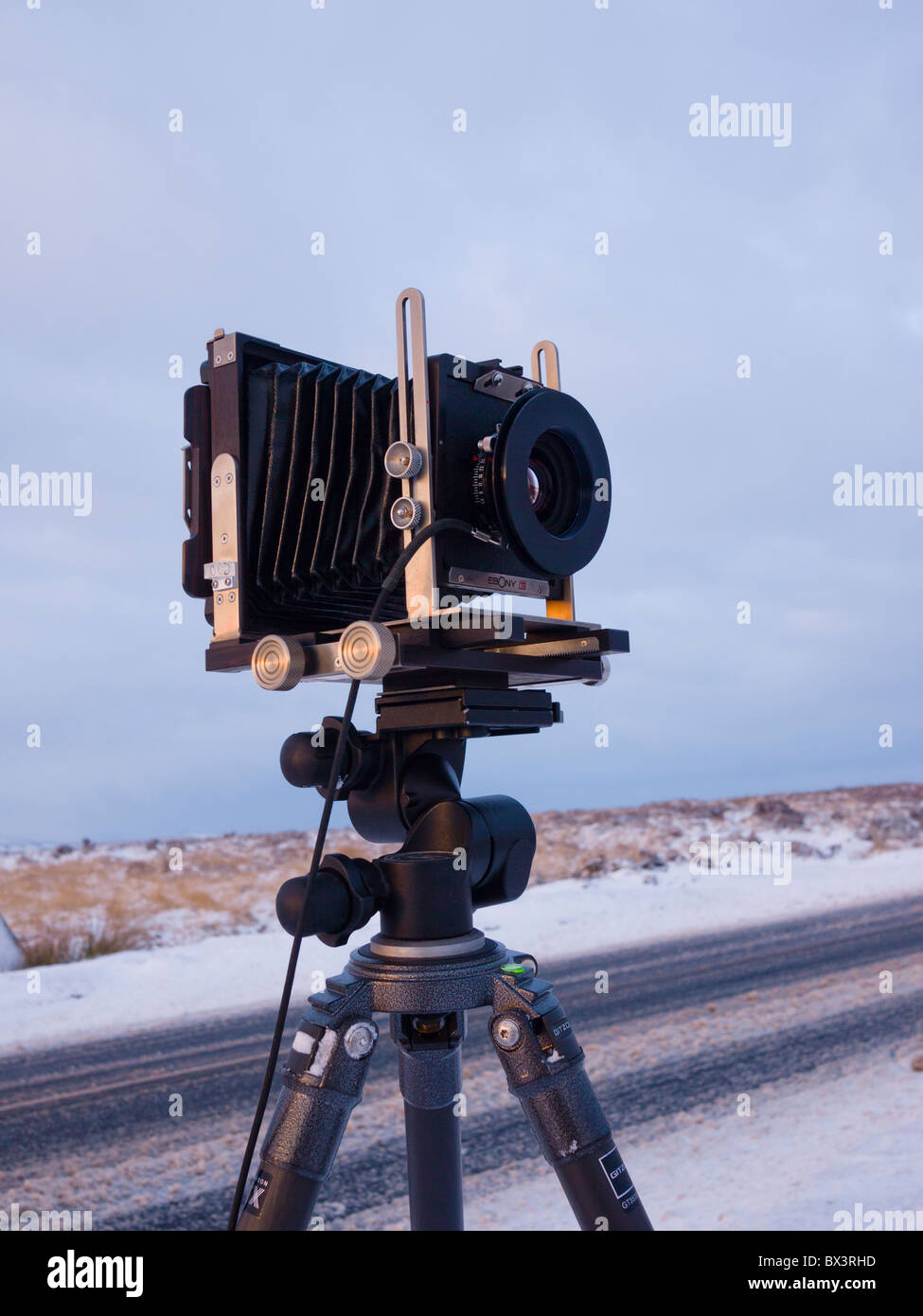 An Ebony RSW45 4x5 inch large format Field Camera being used to photograph a winter landscape. Stock Photo