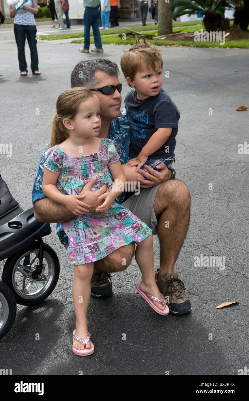 spring arts festival Gainesville Florida father carries his children Stock Photo