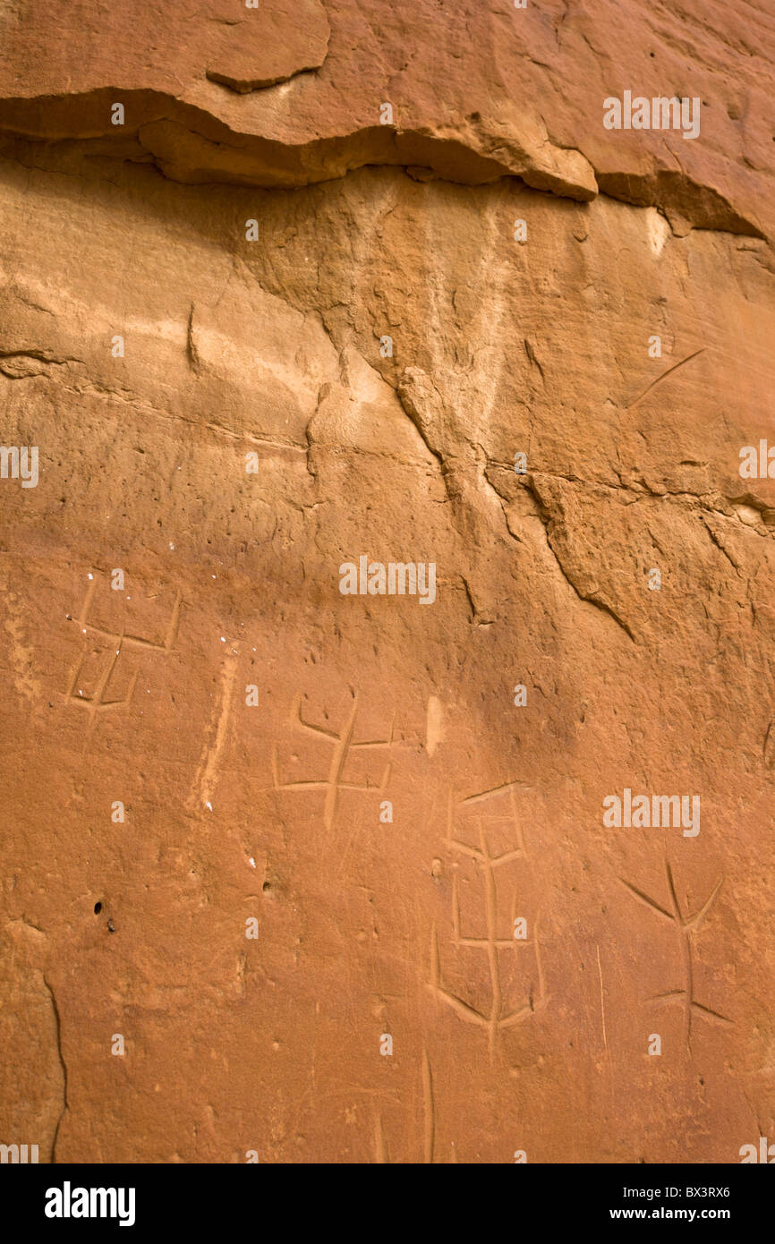 Incised petroglyphs along the petroglyph trail at The Chaco Culture National Historic Site in Chaco Canyon, New Mexico. Stock Photo