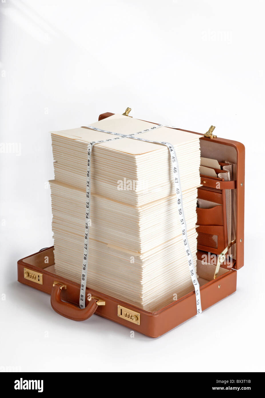 open briefcase with stacks of papers and measuring tape Stock Photo Alamy