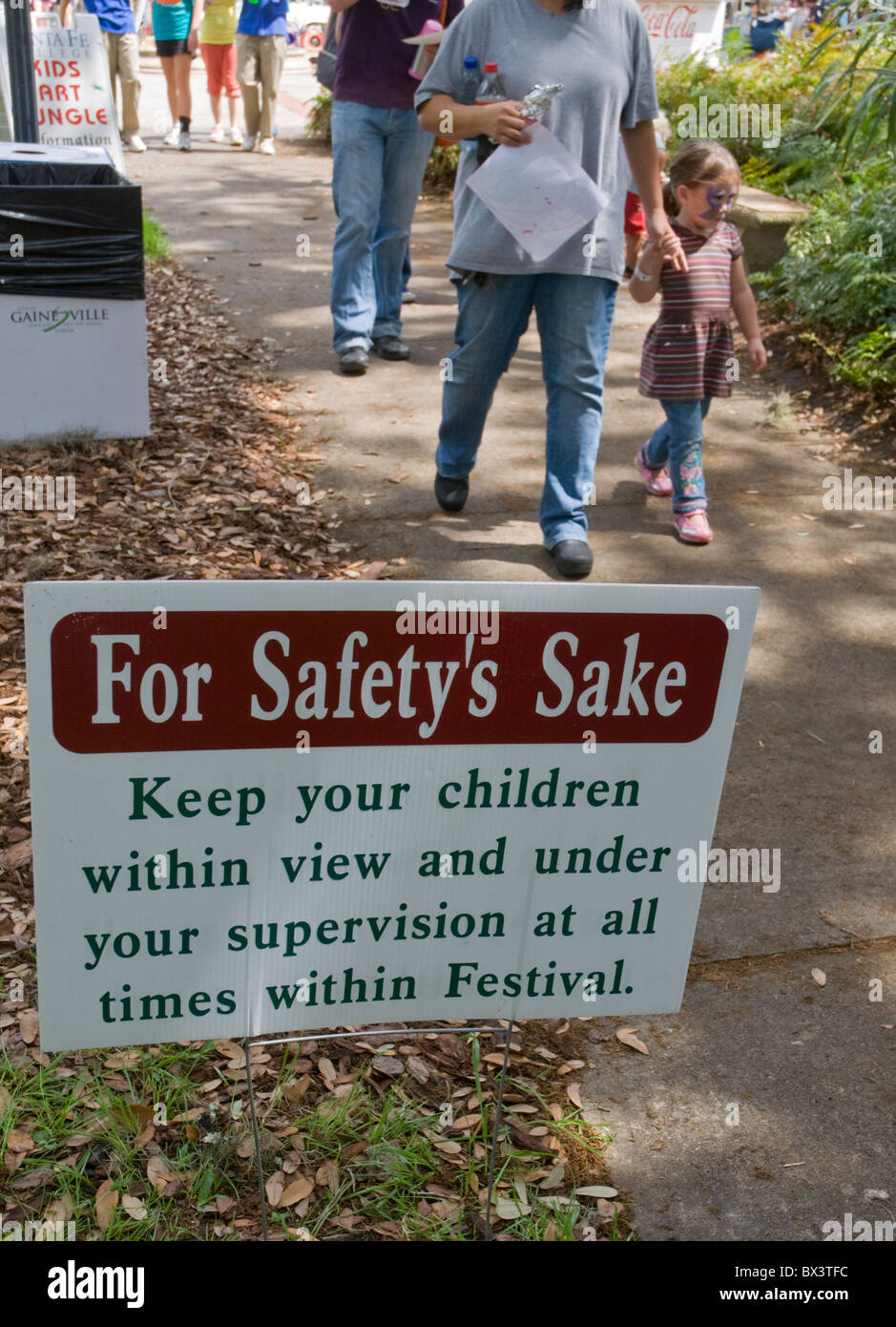 children safety warning sign at spring arts festival Gainesville