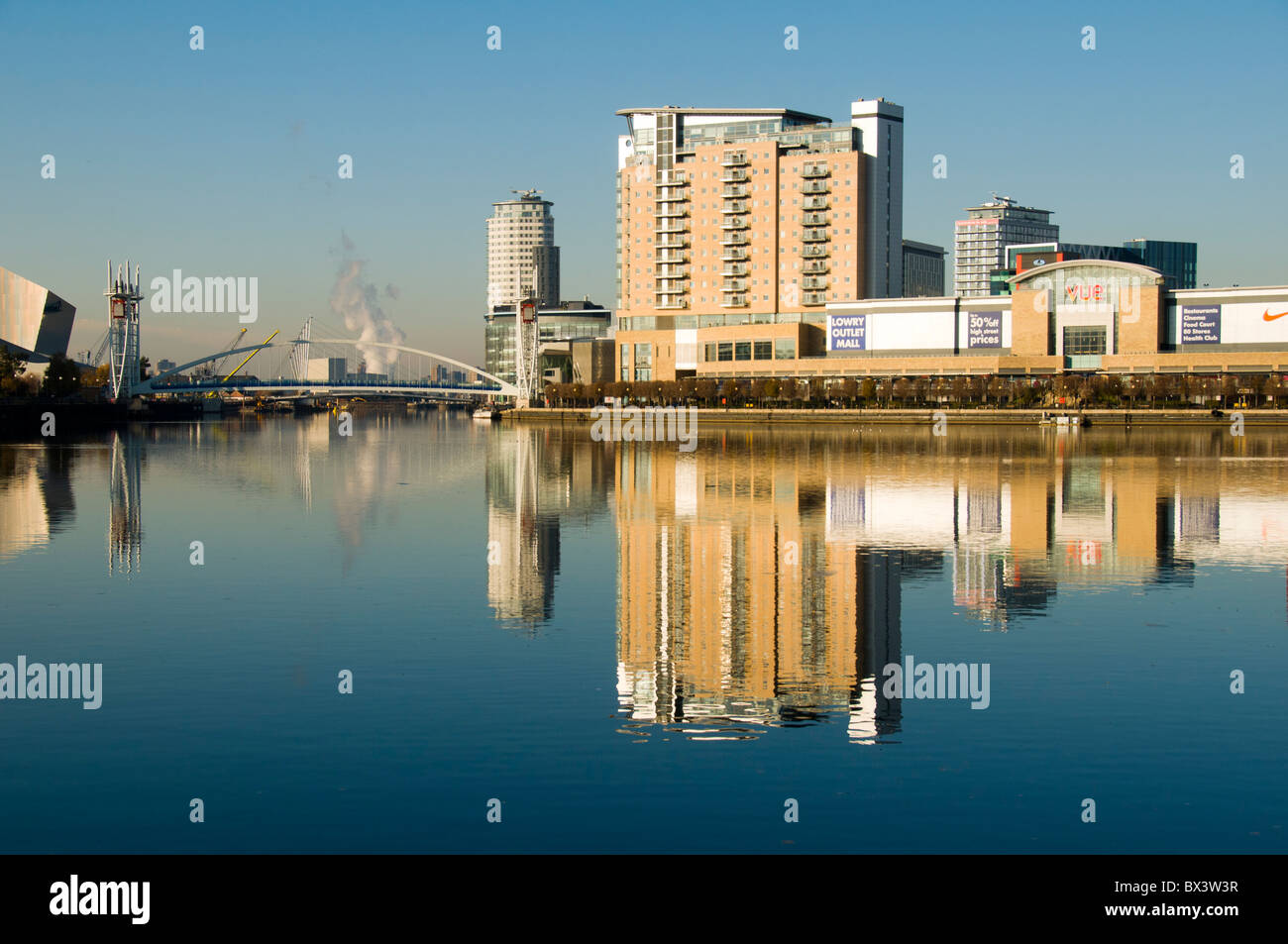 The Millennium footbridge, Imperial Point apartments and The Lowry Outlet Mall at Salford Quays, Manchester, England, UK Stock Photo