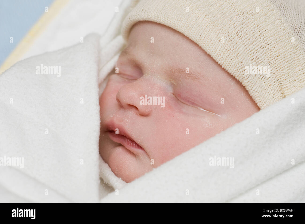 A Newborn Baby Wearing A Cap; Millet, Alberta, Canada Stock Photo - Alamy