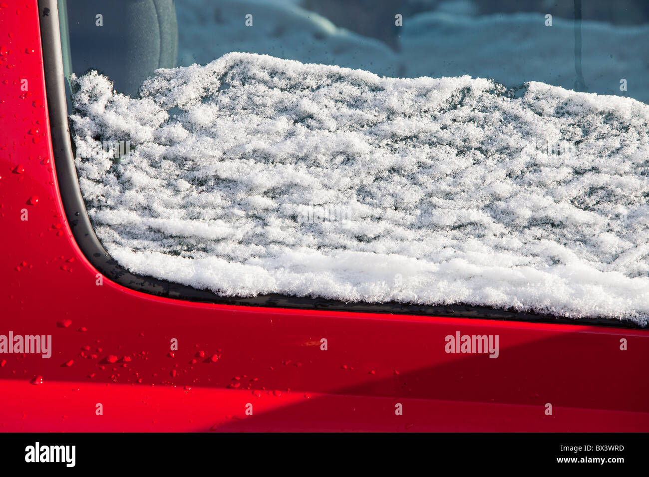 Melting snow on a car Stock Photo Alamy