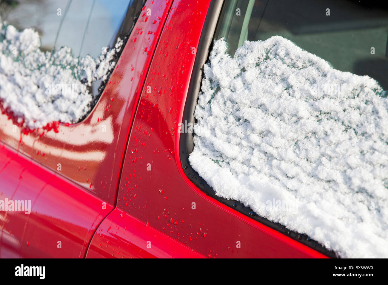 Melting snow on a car Stock Photo Alamy