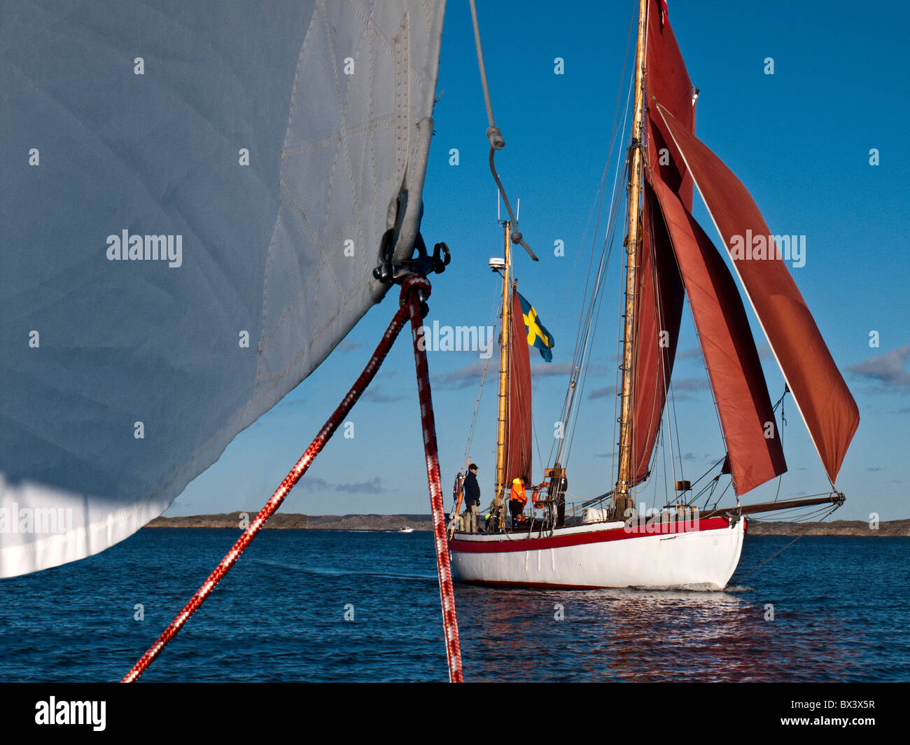 Gaff rig 2 masted ketch under sails. Seen from other sailboat perspective. Stock Photo