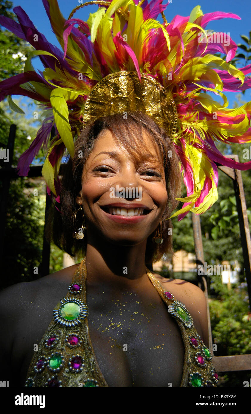 Woman in coulourful costume and head dress at the Notting Hill Carnival in London. Stock Photo