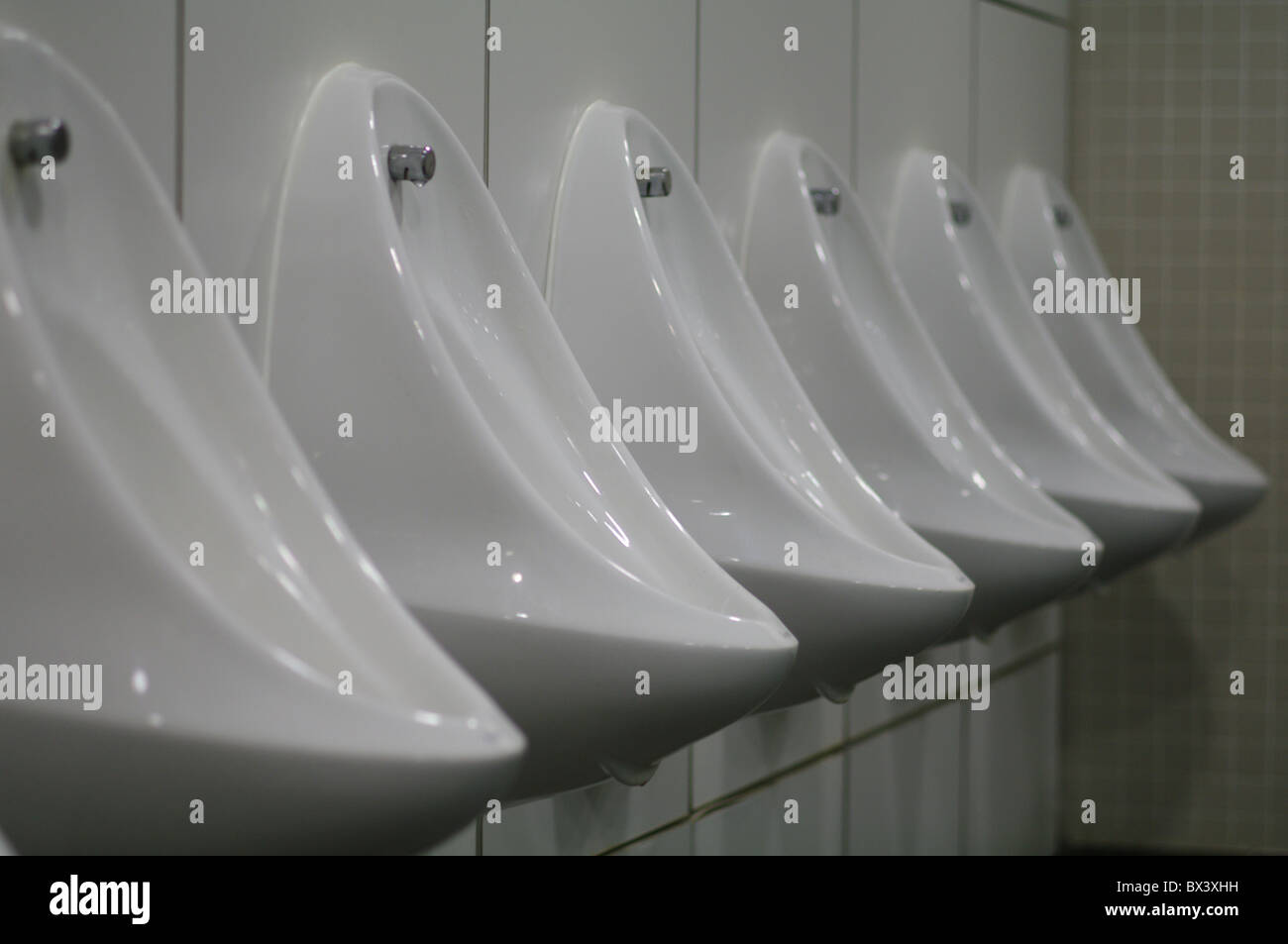 Row of urinals Stock Photo