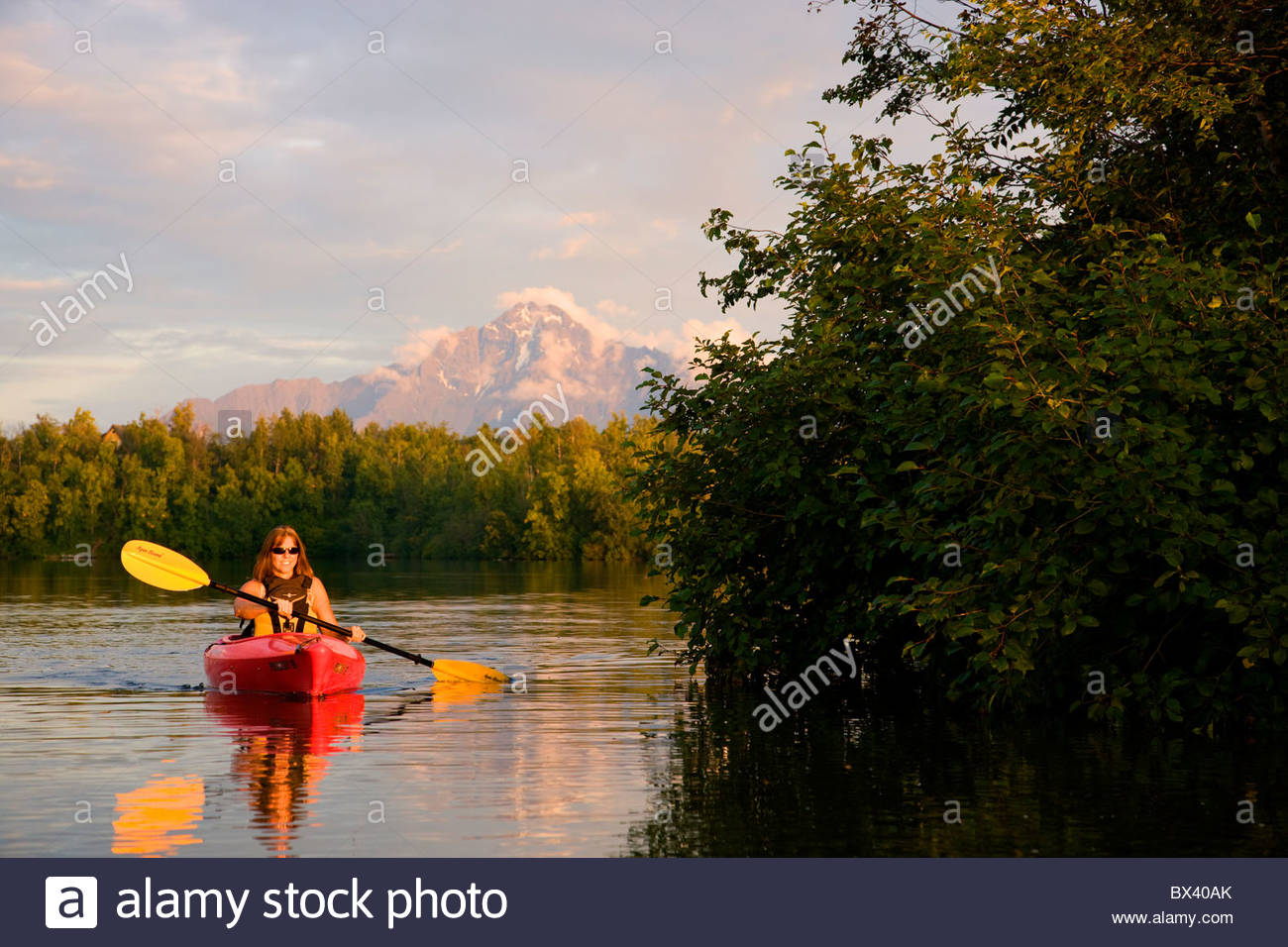 Kayaking on Finger Lake, Wasilla, Alaska. (model released Stock Photo