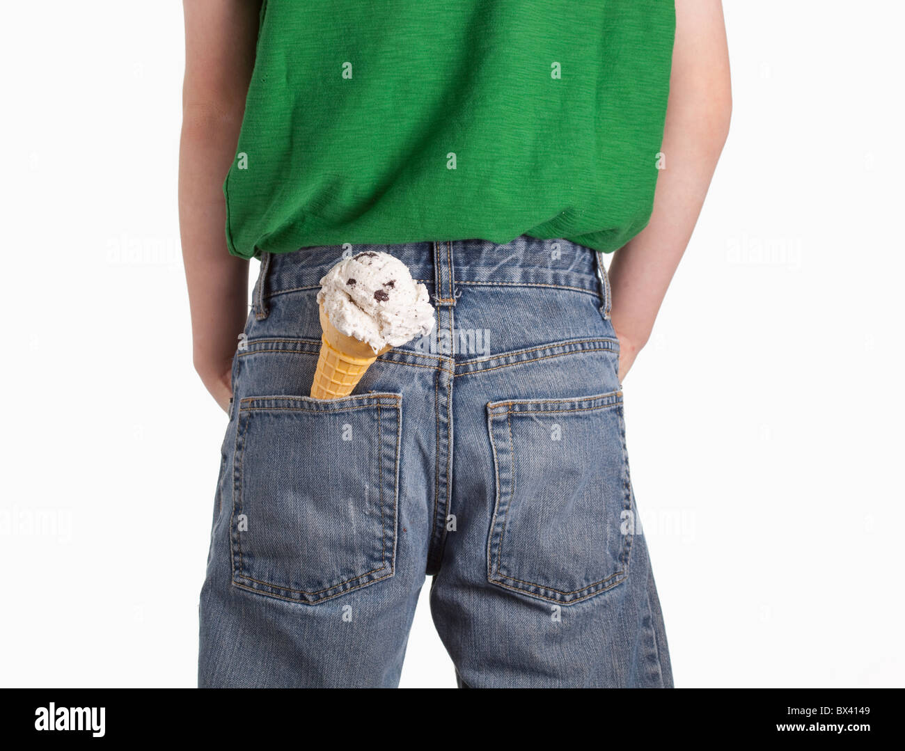 A Boy With An Ice Cream Cone In His Back Pocket Stock Photo