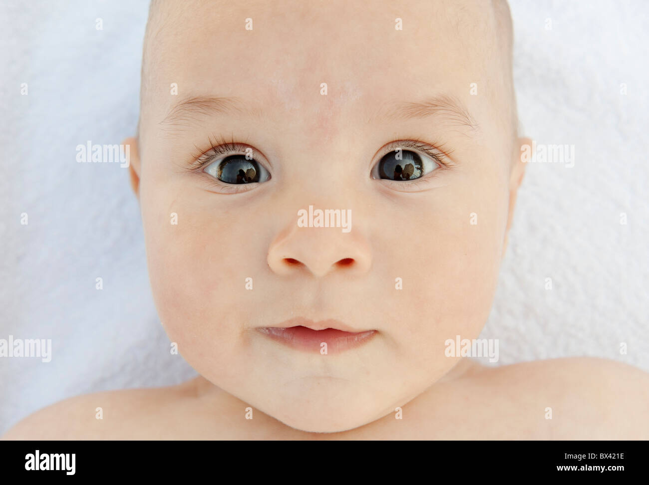 A Wide Eyed Baby Stock Photo