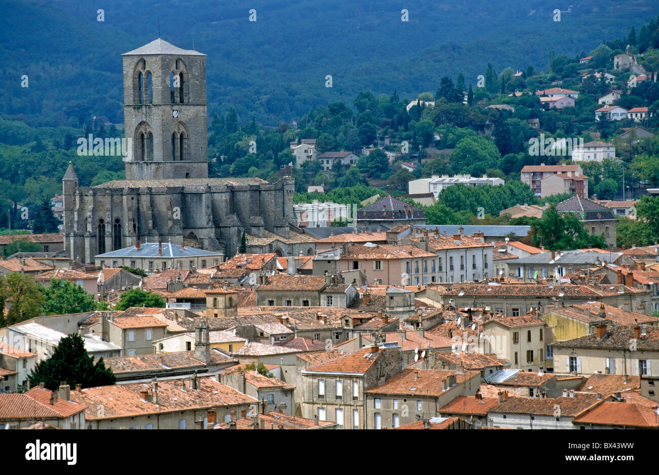 Cathedral towering above the red roofs of Lodeve, Herault, France Stock Photo