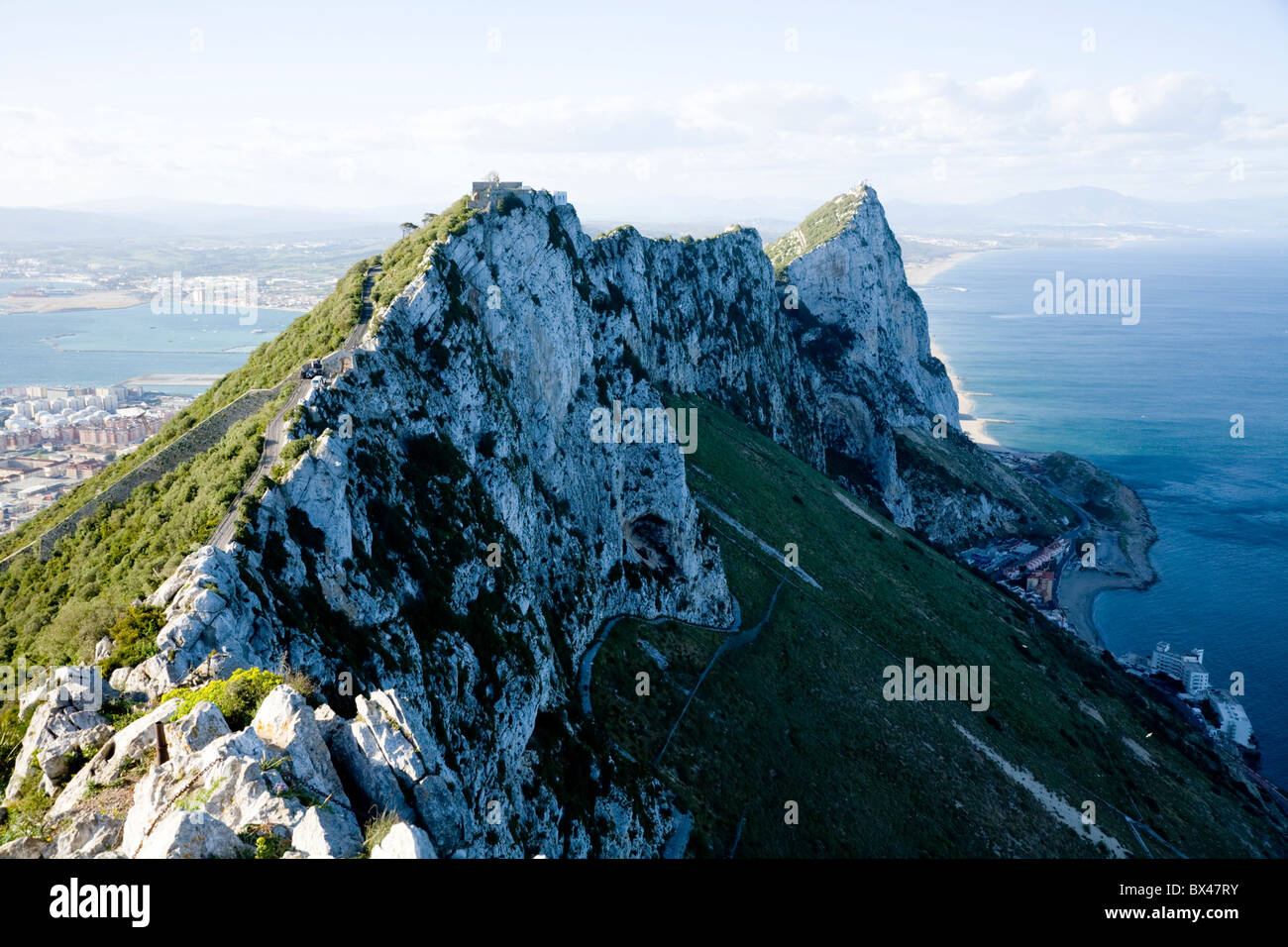Cliff on the side of the ridge of the Rock of Gibraltar, and peak tops. Stock Photo