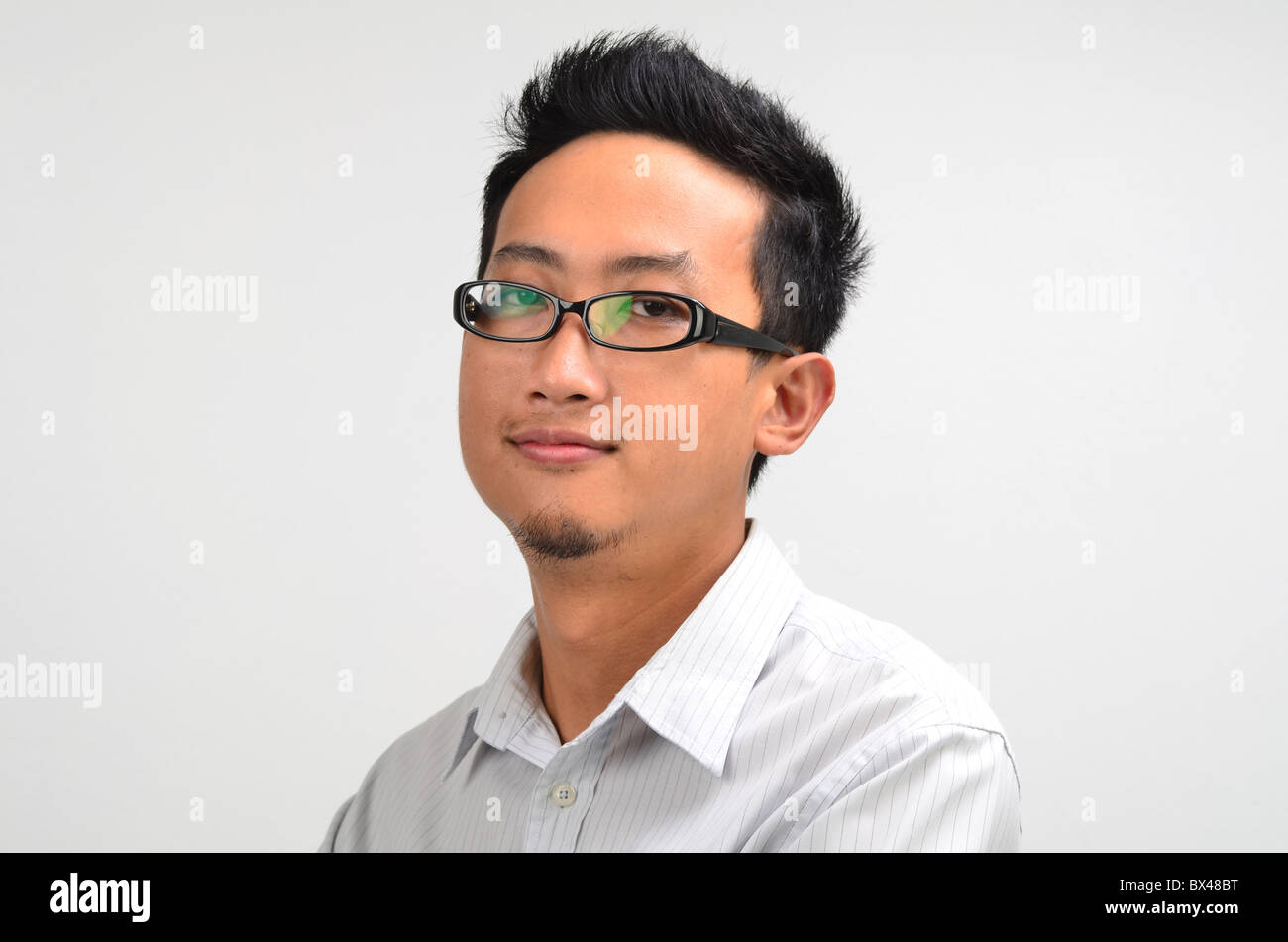 young asian business man smiling Stock Photo - Alamy