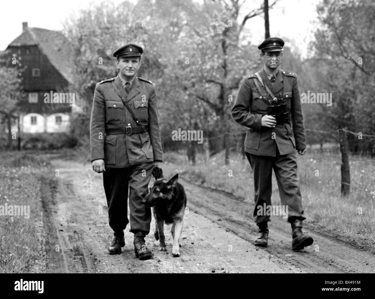 Policemen (Public Safety Officers) with service animal. Hermanice, Czechoslovakia 1965. (CTK Photo / Josef Nosek) Stock Photo
