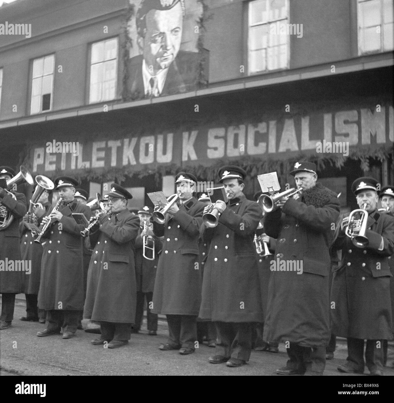 Czechoslovakia Prague 1949. Band plays folk music and huge Klement Gottwlad portrait hangs