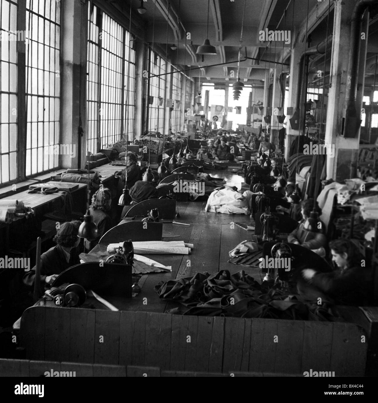 Czechoslovakia  1950, Skoda Tudor production (location uknown).  Workers work on upholstery for car interior. CTK Vintage Photo Stock Photo