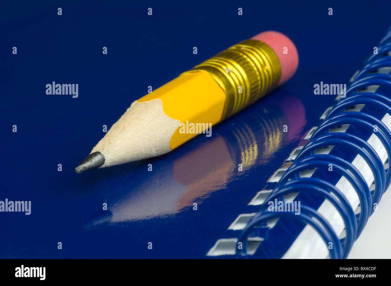 Pencil and memo pad Stock Photo