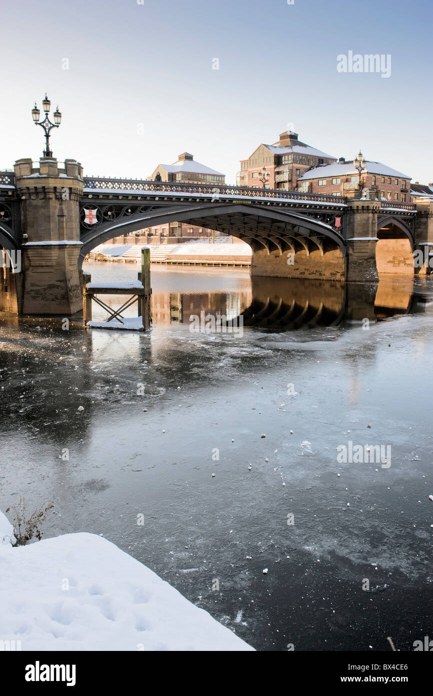 Skeldergate Bridge shot from South Esplanade in York, crossing the frozen River Ouse, with the Aviva Office building in the distance. Stock Photo