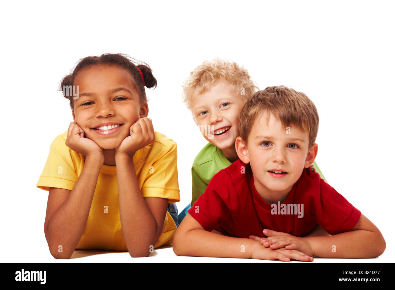Portrait of three children lying and looking at camera Stock Photo
