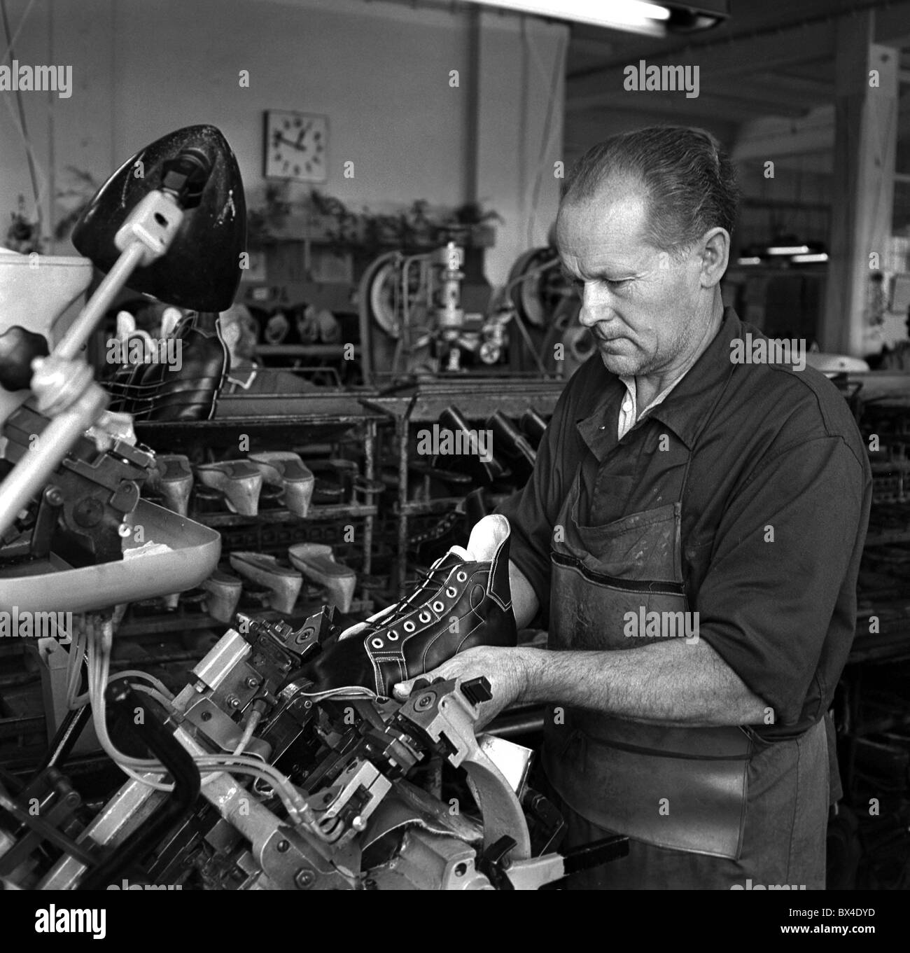 Shoemaker manufactures sport shoes in skutec hires stock photography