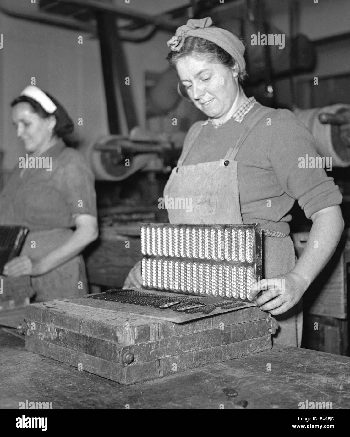 Lovosice Czechoslovakia, 1951. Women work at chocolate and candy