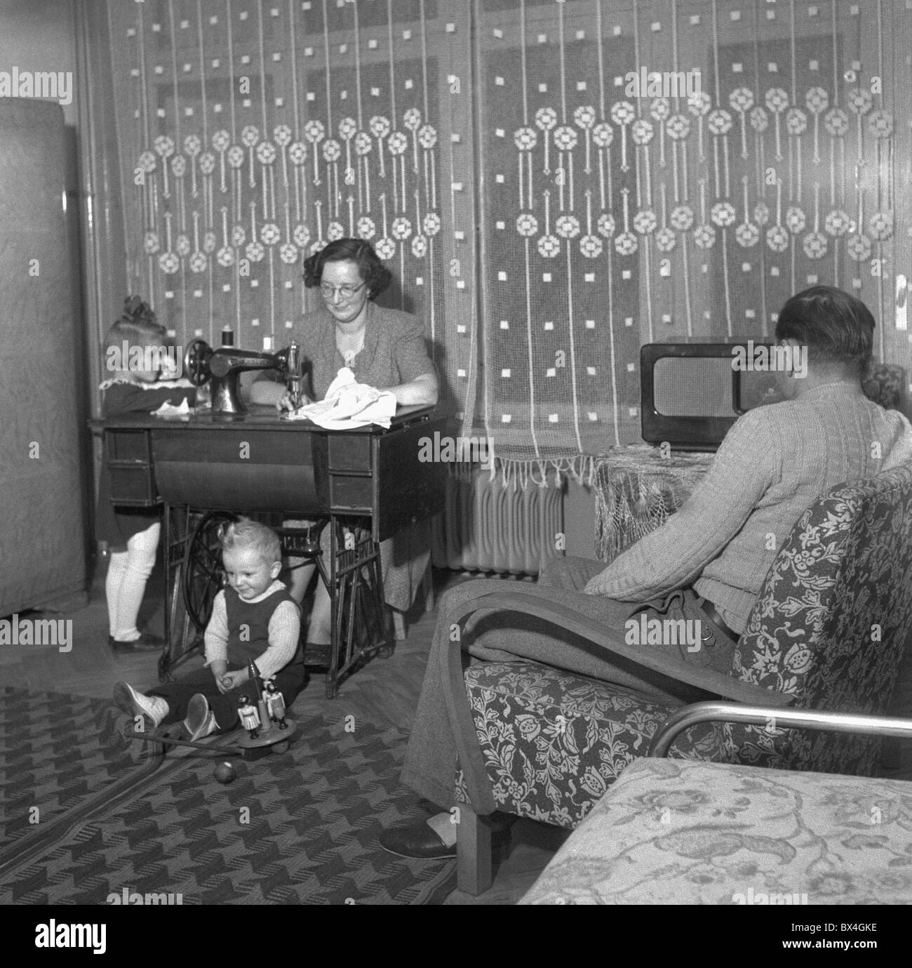 1950, Socialist living, sewing machine, Communist propaganda Stock Photo