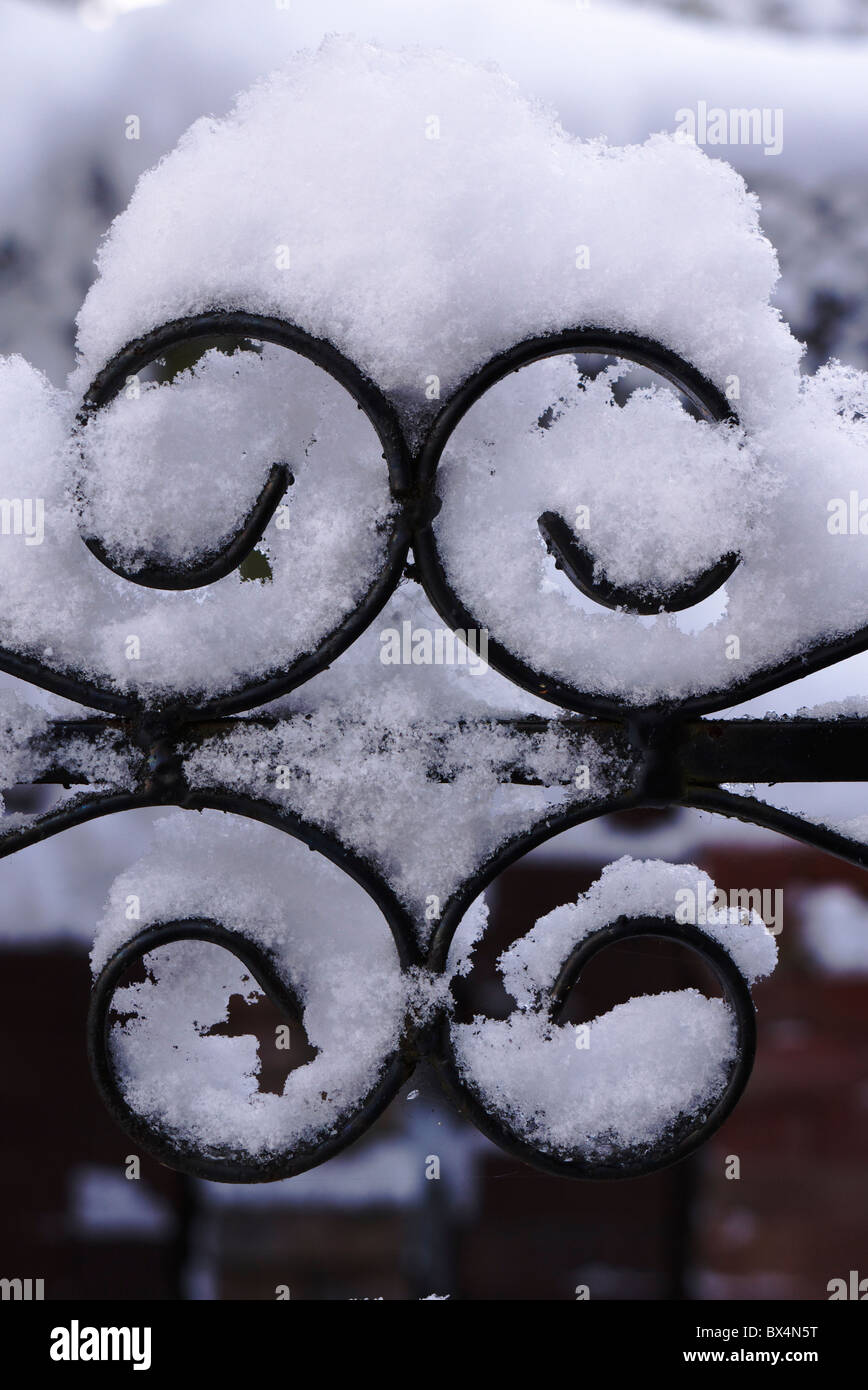 Build up of snow on iron gate Stock Photo
