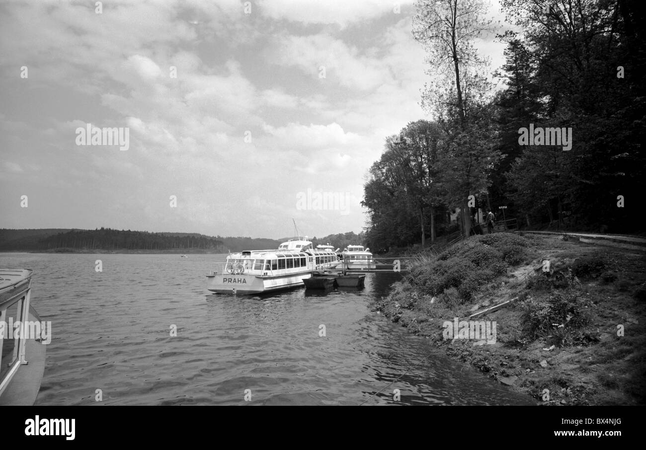 Czechoslovakia Orlik Lake. A ferry boat waits for passangers. This Socialist propaganda of seemingly idyllic life had been Stock Photo