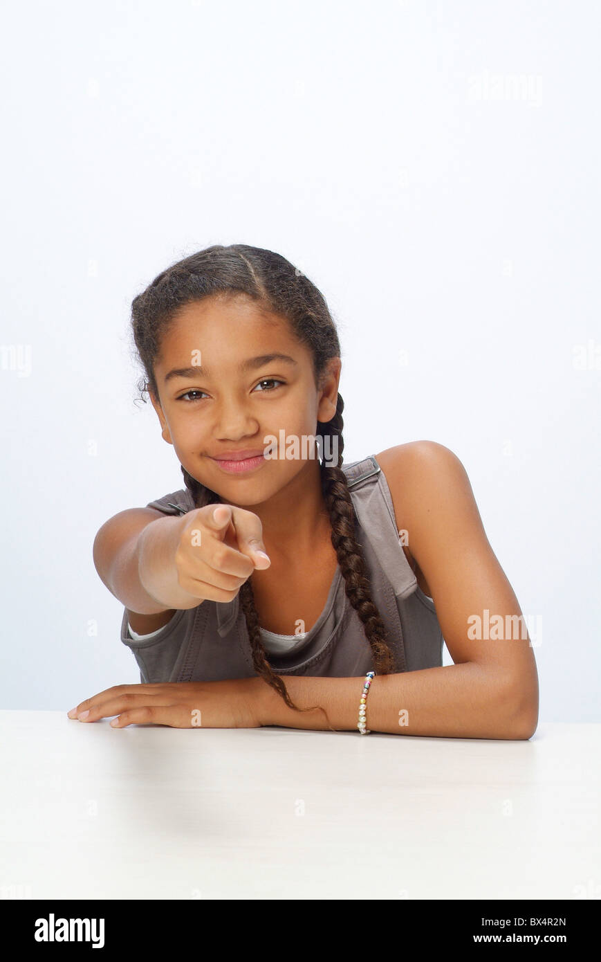 Portrait of a girl with upraised forefinger Stock Photo