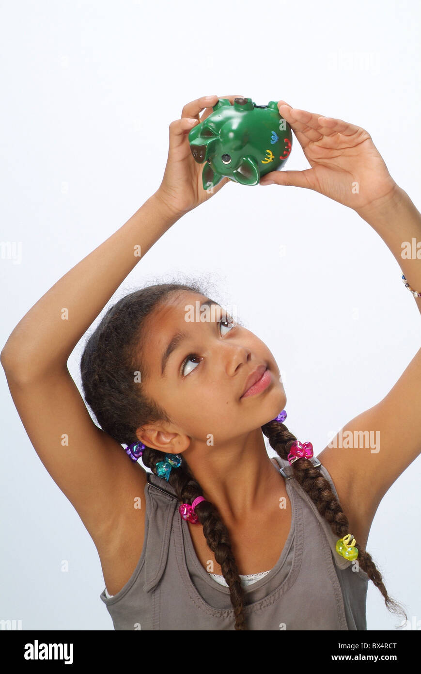 A girl with a piggy bank Stock Photo - Alamy